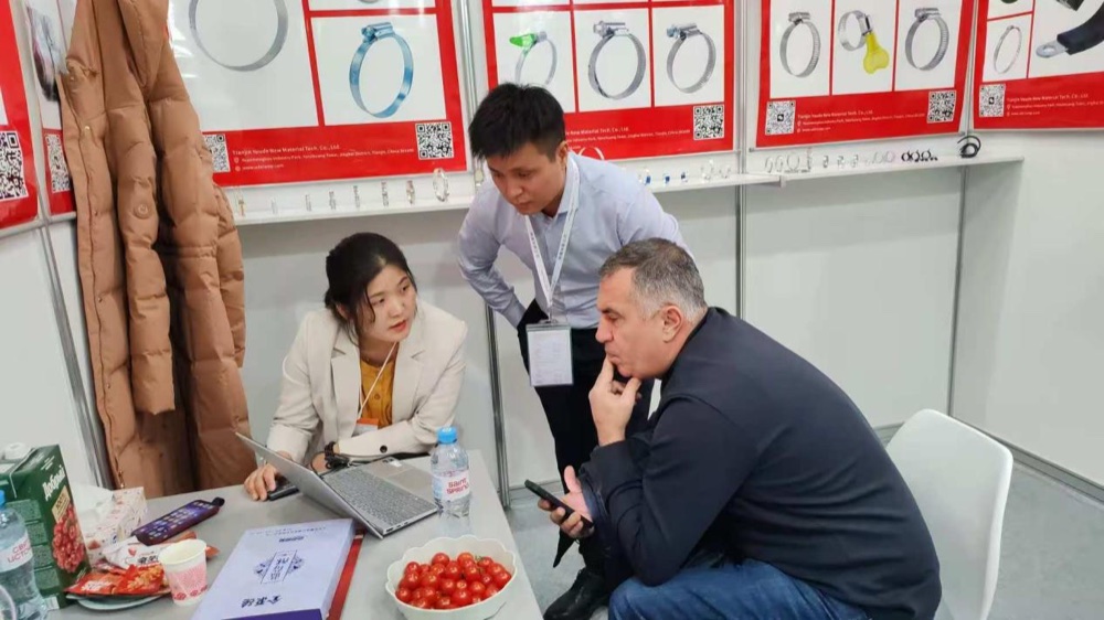 Customers visiting the Youde booth