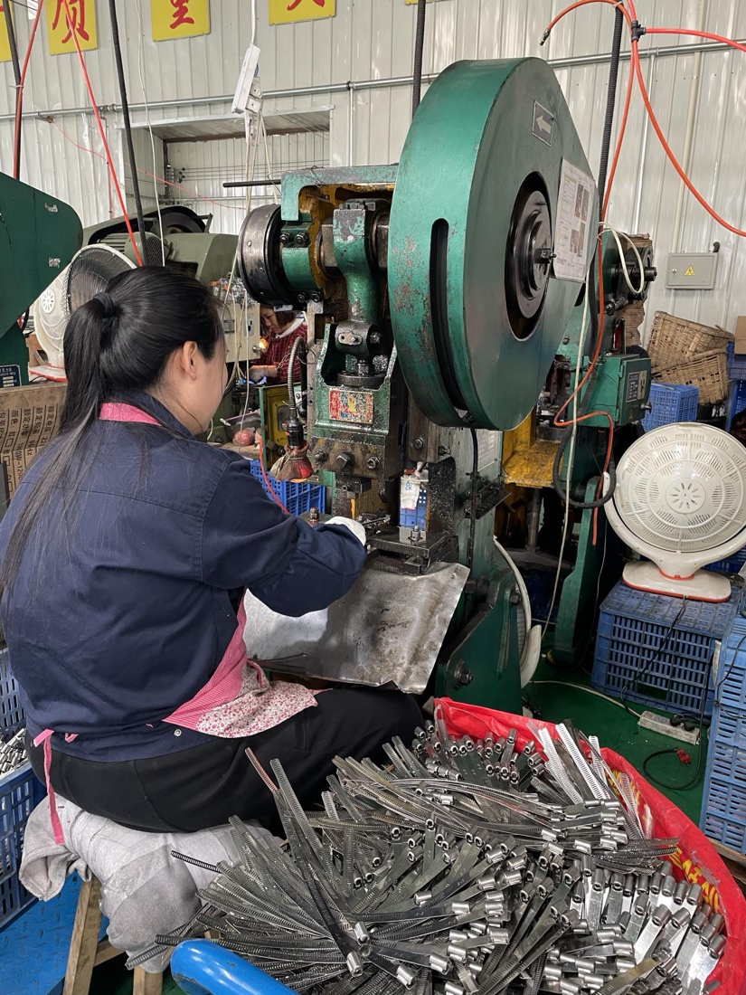 Worker operating a stamping press